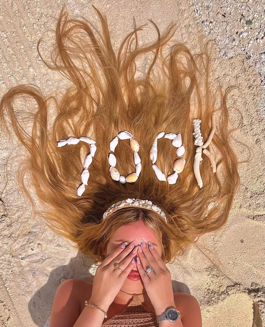 700K followers milestone, written in shells